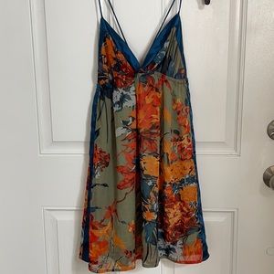 Short dress, beautiful pattern. Low cut top, shows off your back. SO CUTE!